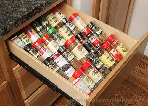 Kitchen spice drawer in hickory cabinets