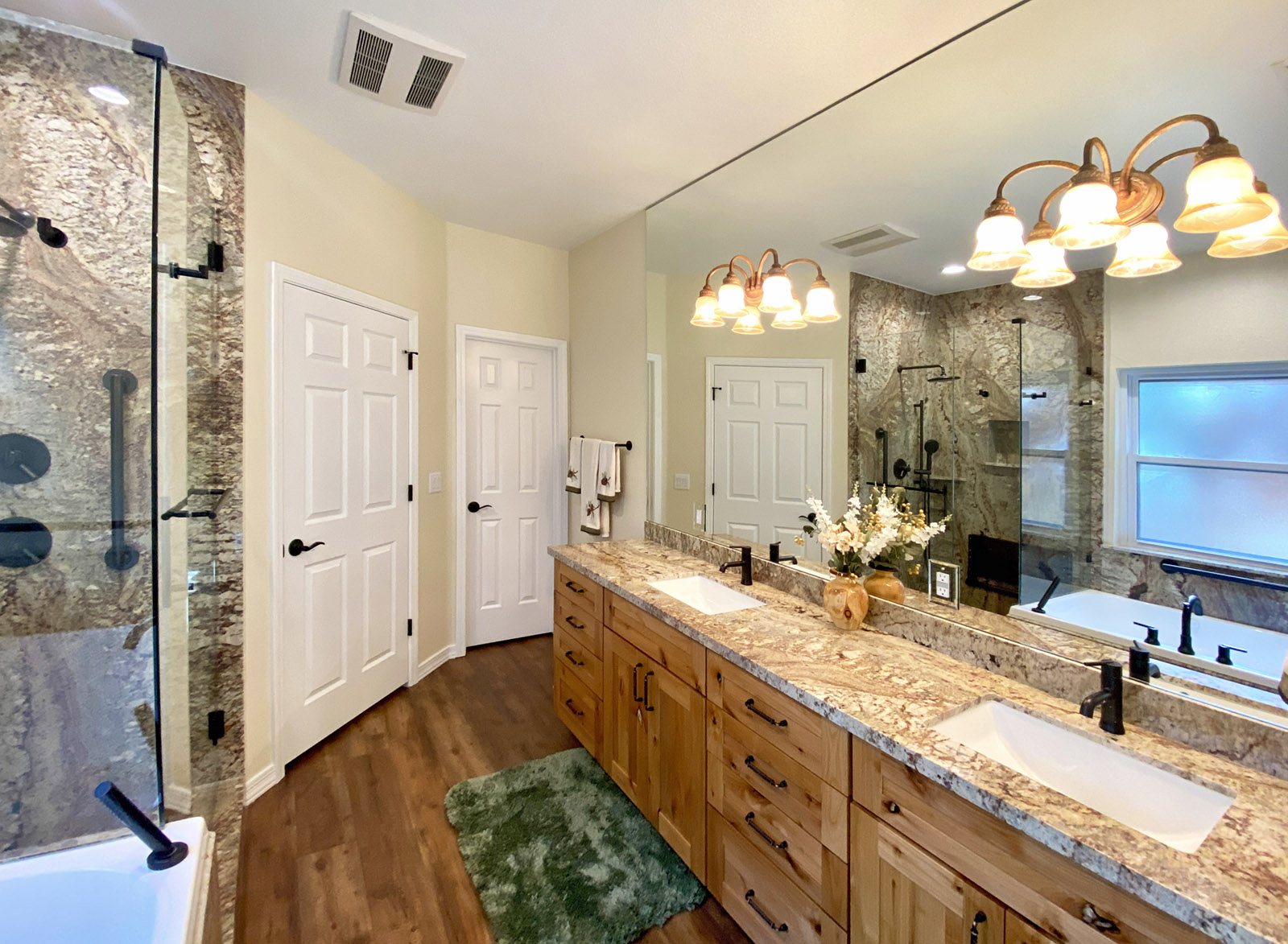 Bathroom remodel including grantie counters with undermount rectangular sink bowls.