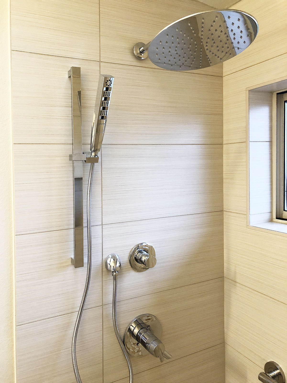 New bathroom fixtures including a new rain shower head. 