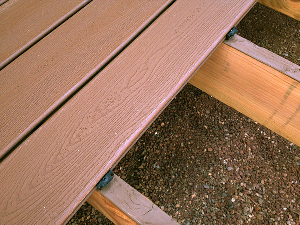 Staining of top of joists before installing Trex Deck boards