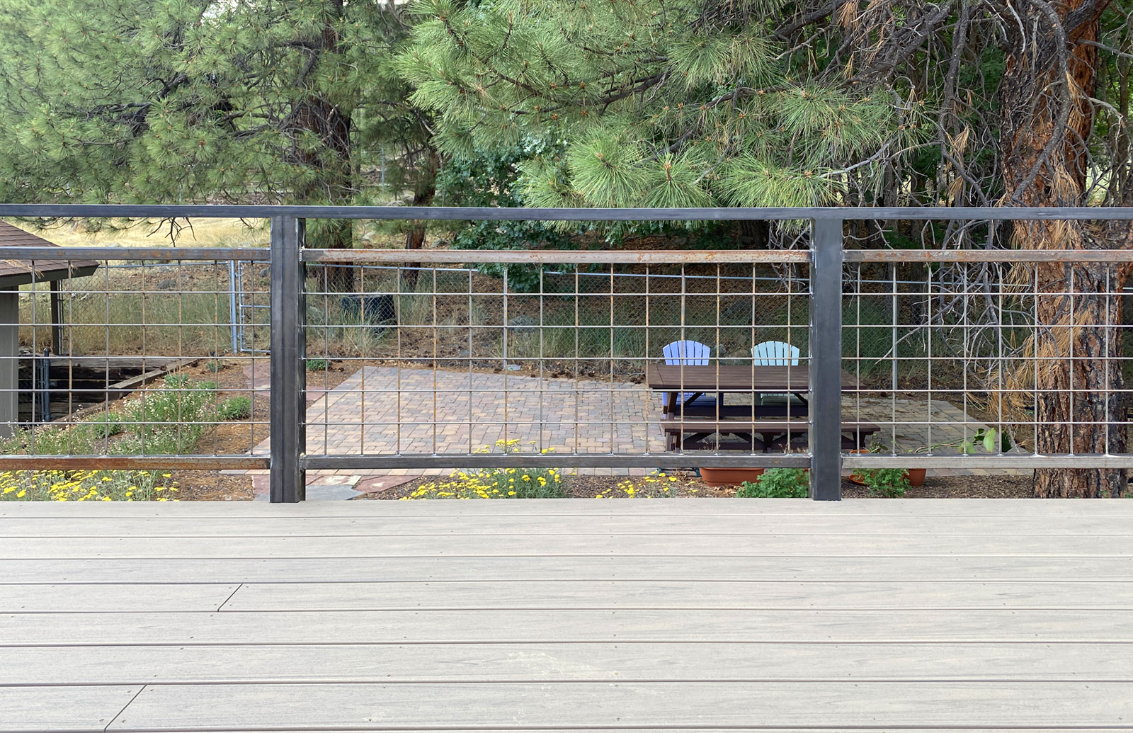 Trex deck with rusting metal railing in Flagstaff
