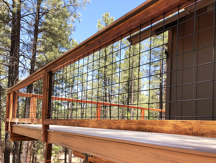Wild Hog Railing in a Redwood Frame on a Trex Tiki Torch deck