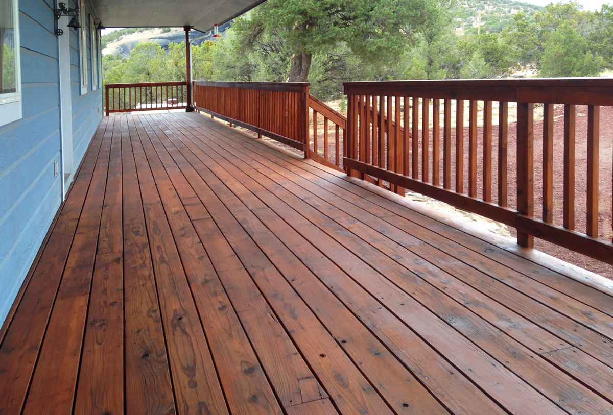 Deck Staining Re-staining a redwood deck and railing.