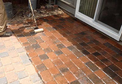 Applying concrete sealer to pavers in Flagstaff AZ