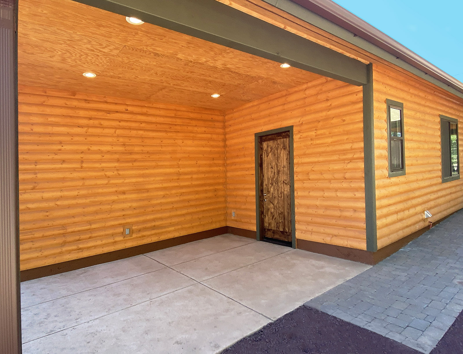 Log siding with acrylic stain