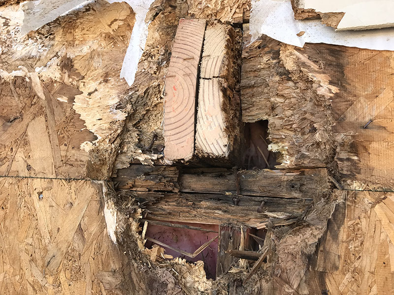 Rotted wood caused by a cantilevered deck
